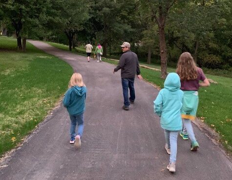 a family walking on a trail